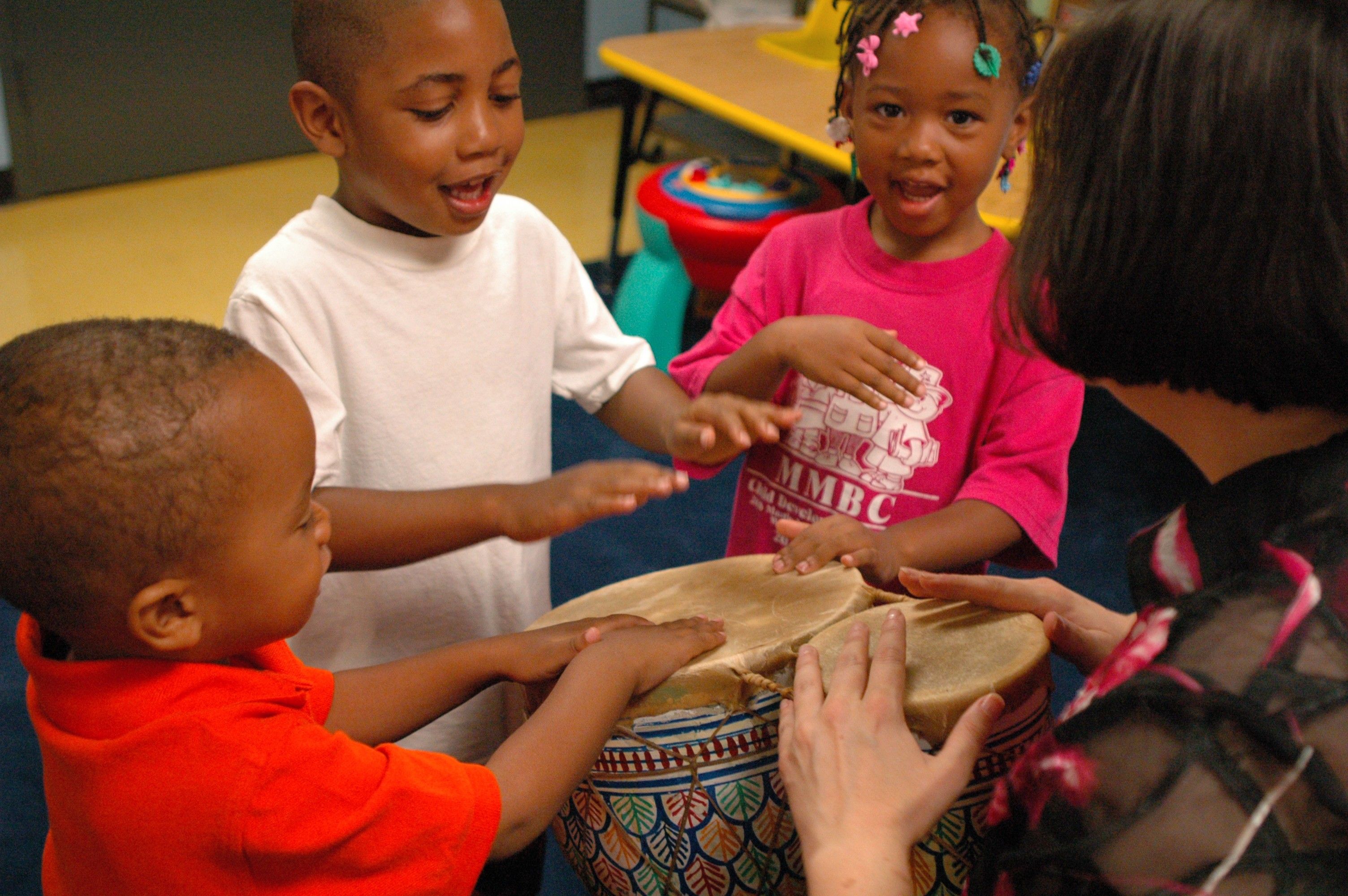 Children playing with drum