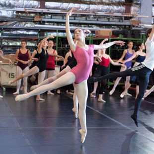 Photo of high school students participating in a ballet class