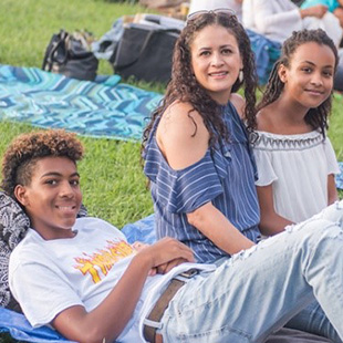 Photo of a family enjoying a performance at Wolf Trap
