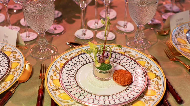 Gourmet dish on decorated plate.