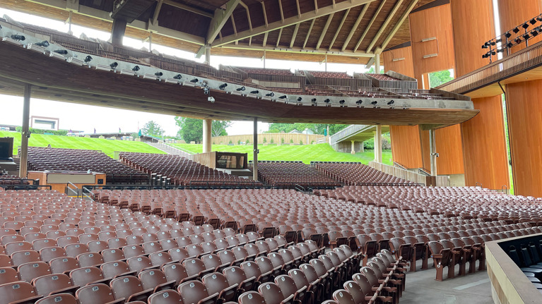 Wide view of Filene Center seating with new aisles and accessible walkways under a wooden roof structure.