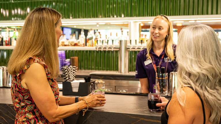 Two lounge guests at the Meadow Lounge bar.